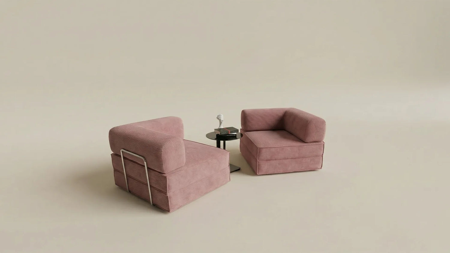 Sofa modular de pana rosa con mesa auxiliar sobre fondo profesional de estudio fotografico