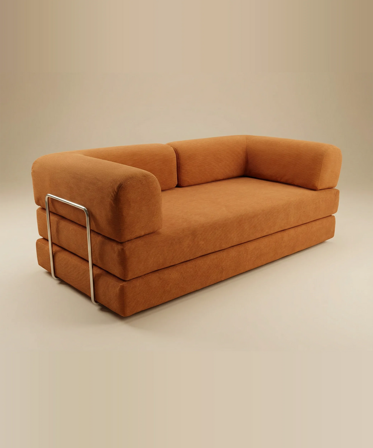 Sofá cama Taburiente en color terracota con diseño moderno y estructura de compresión para espacios versátiles y confortables