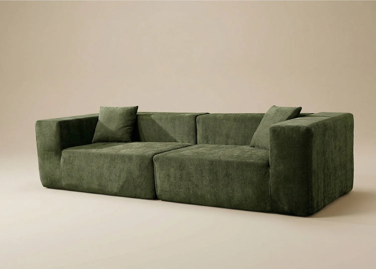 Sofá Naos verde robusto y elegante, diseño sólido que evoca fuerza y presencia imponente en cualquier espacio.