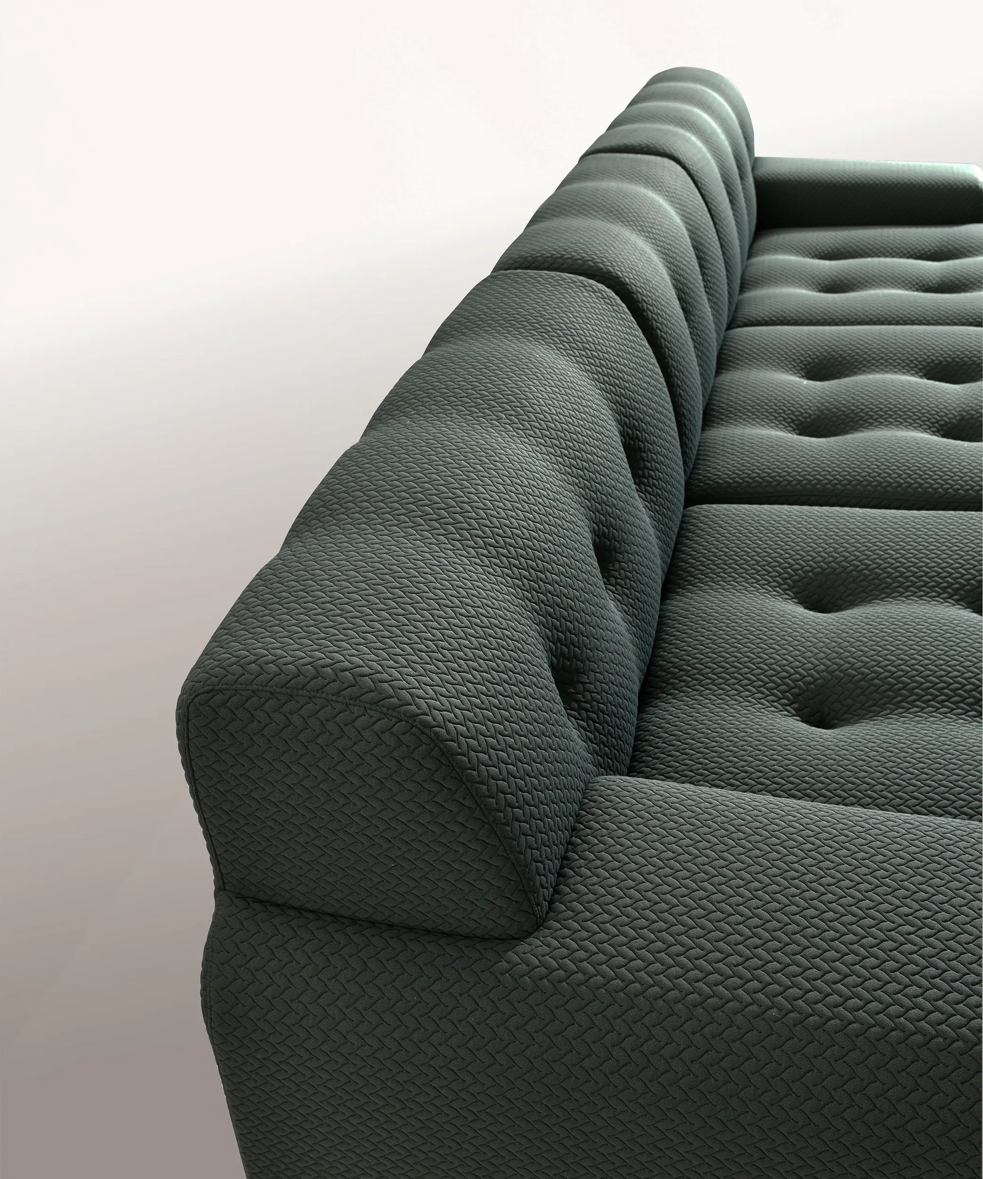 Sofá modular Orotava en tono oscuro con textura acolchada, diseñado para confort y estilo contemporáneo.