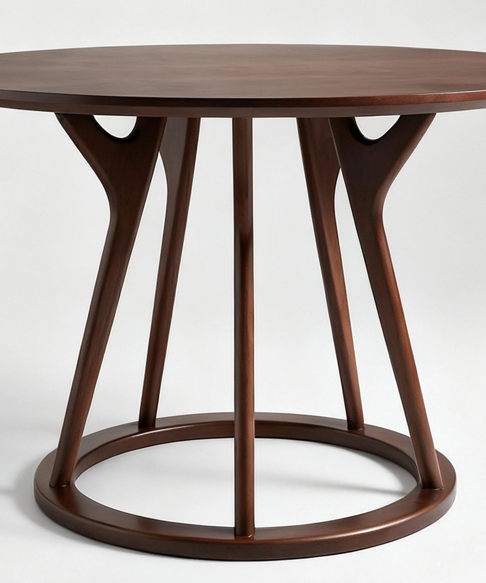 Mesa Vegueta de comedor en madera de fresno nogal oscuro con diseño contemporáneo y estructura circular elegante.